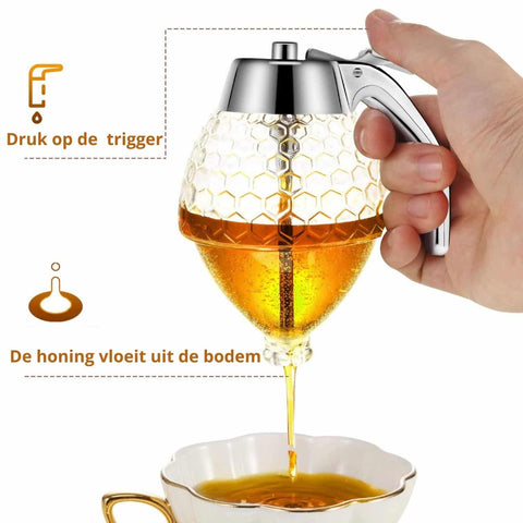Honingdispenser in gebruik Honingdispenser in gebruik